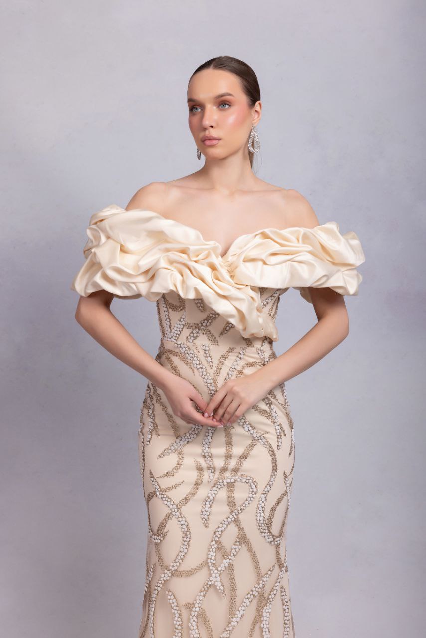 Odrella Champagne Off-the-Shoulder Gown with Sculptural Ruffle & Silver Embellishments